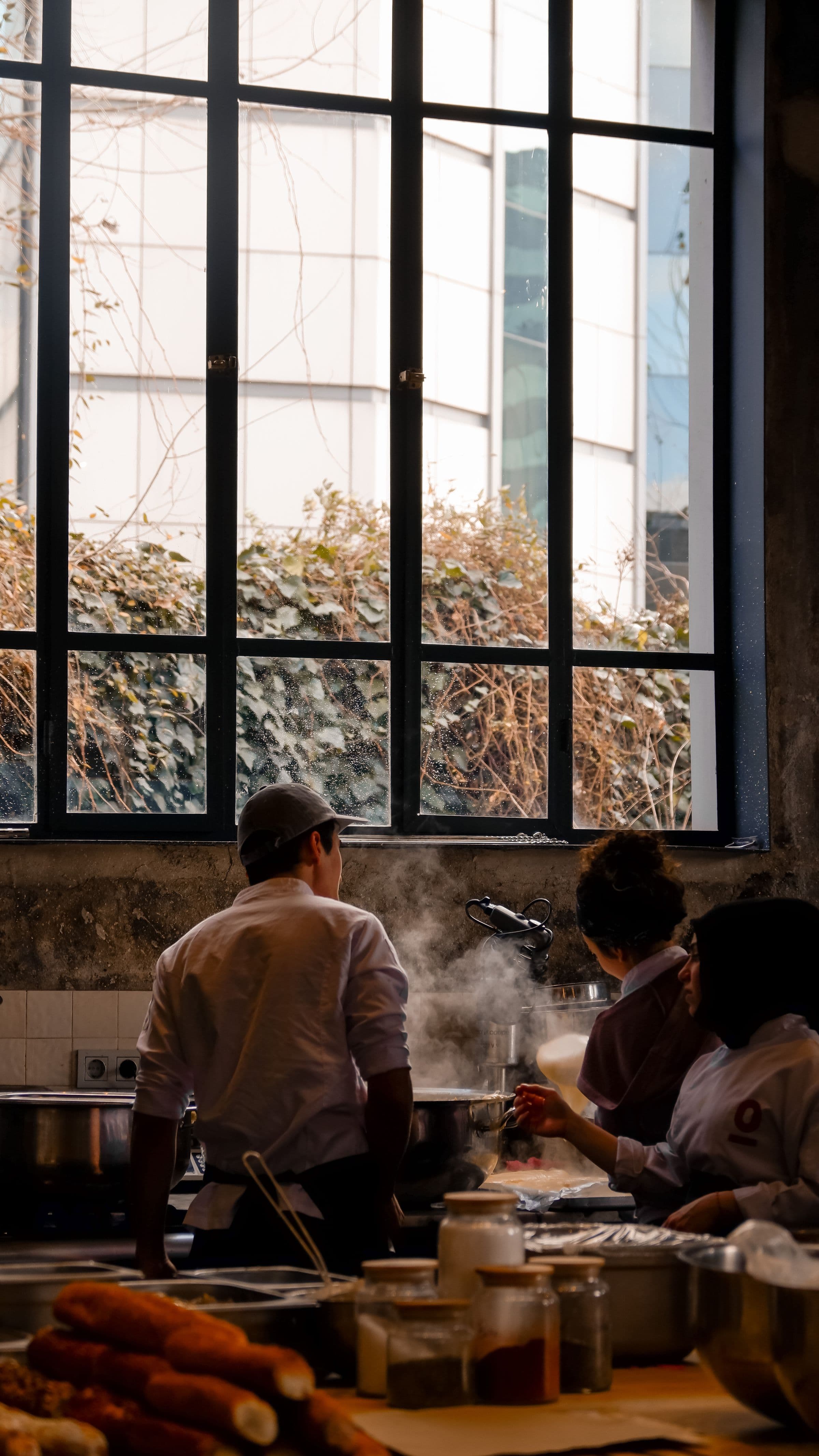 A chef working the line on the kitchen pass during service